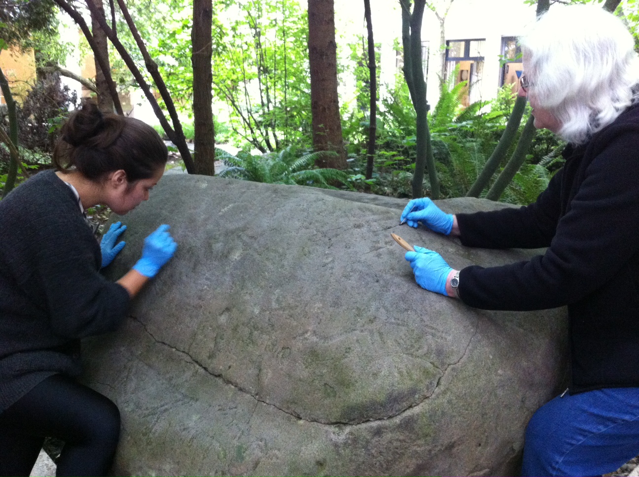 carol cleaning petroglyph